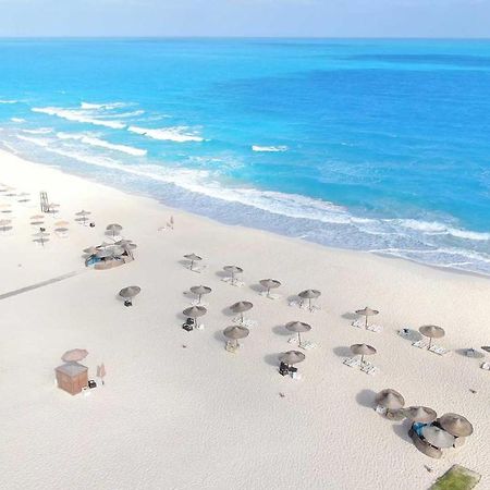 Tolip North Coast Hotel El Alamein Exterior photo Aerial view of the beach